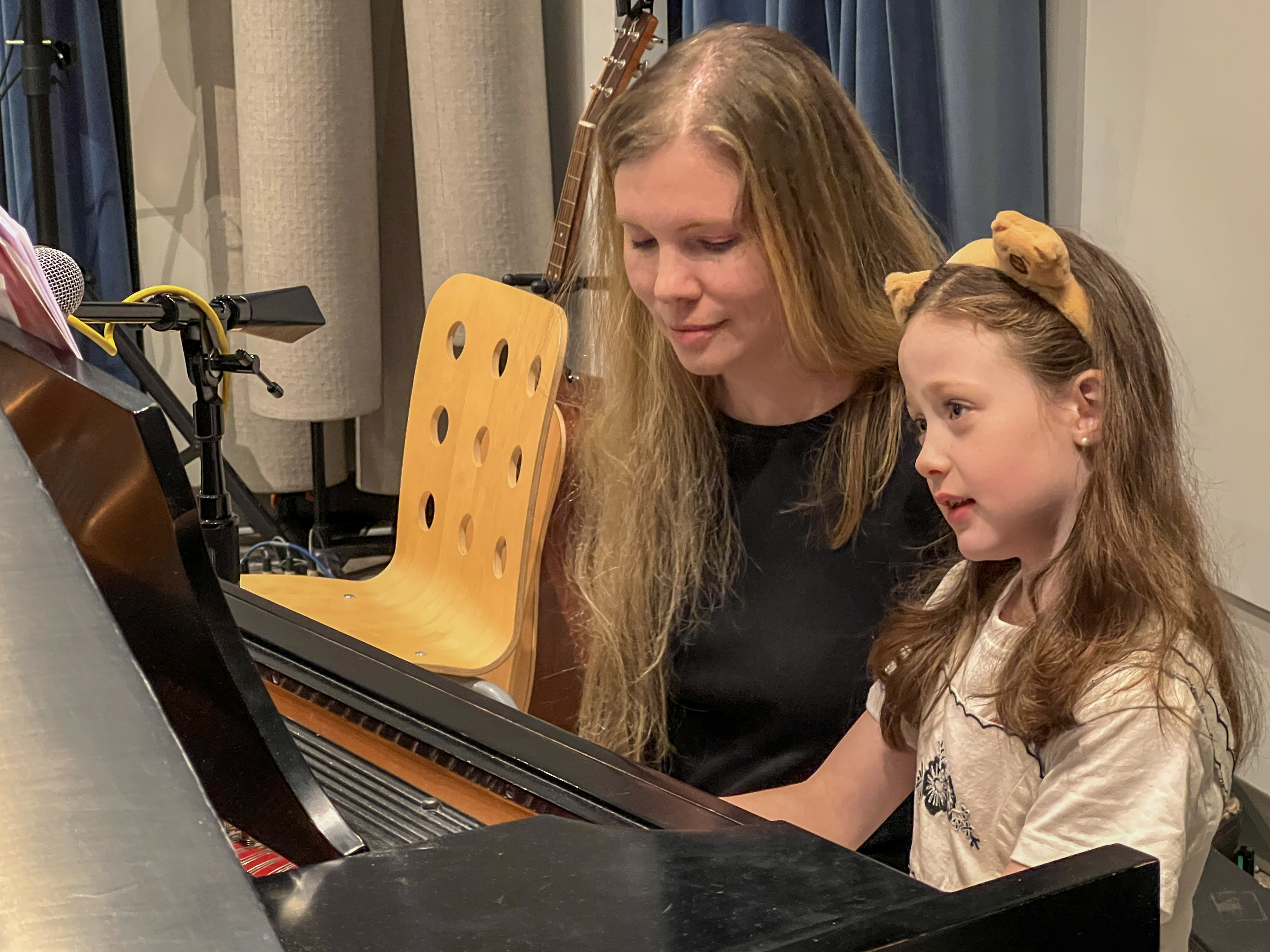 Jessica Westfall teaching piano with a student